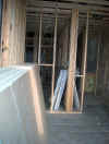 Sheetrock waits on the second floor...